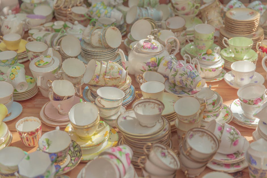 A vibrant assortment of vintage ceramic tea sets with a floral theme, showcasing delicate porcelain craftsmanship.